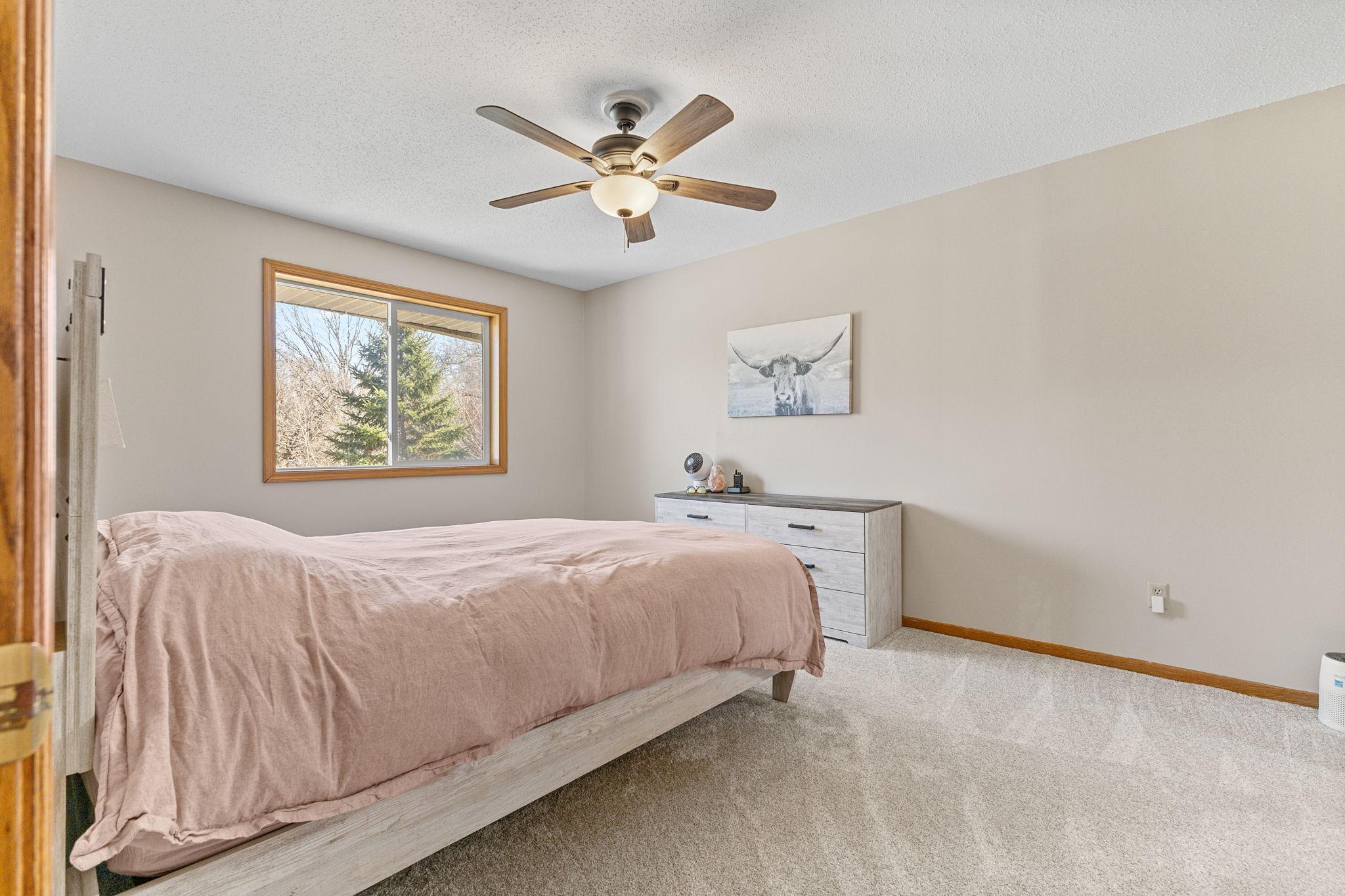 Upstairs you will find two generous bedrooms including a primary suite.