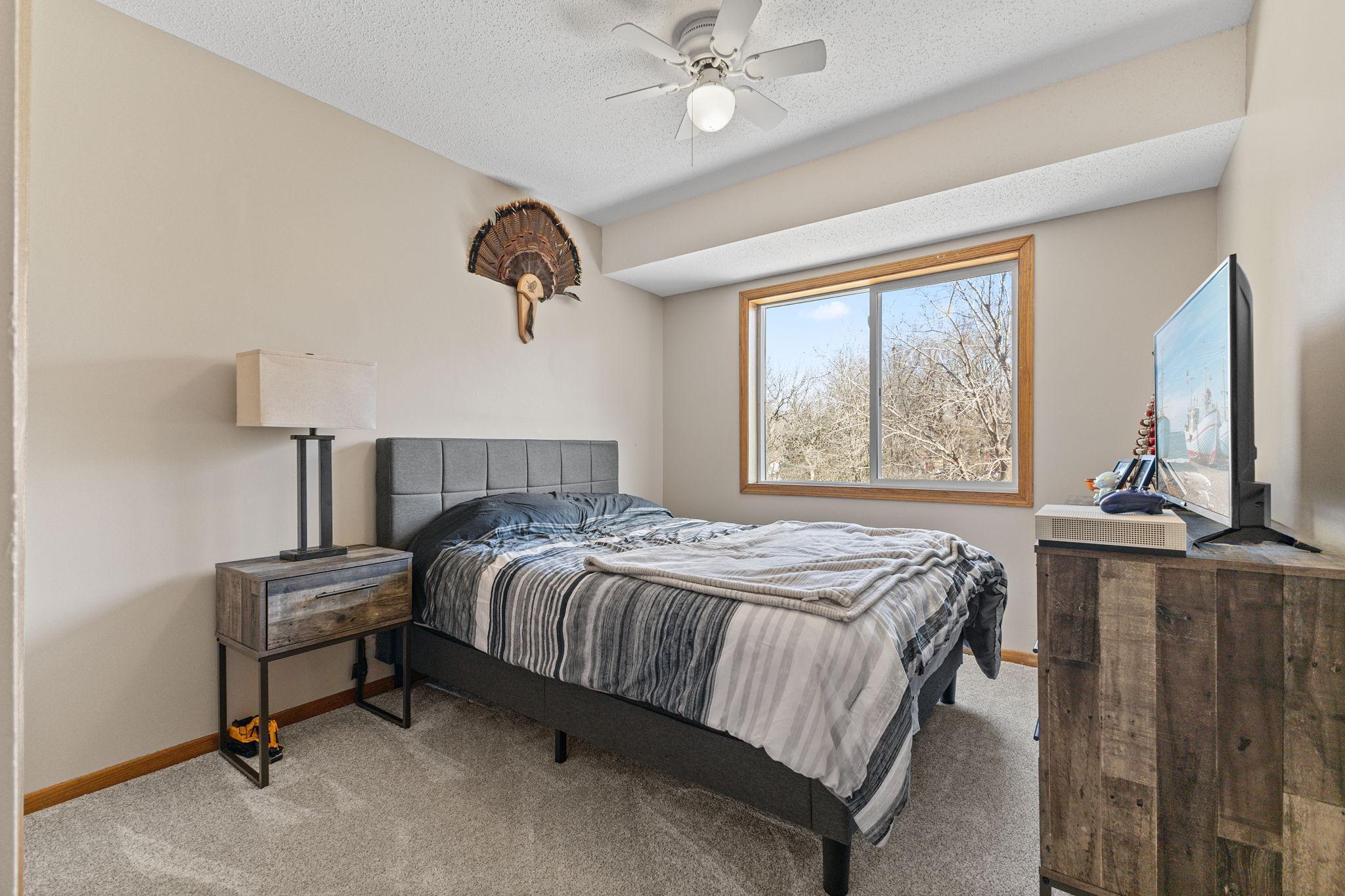 The second upper level bedroom is conveniently located near the primary, ideal for keeping loved ones close.