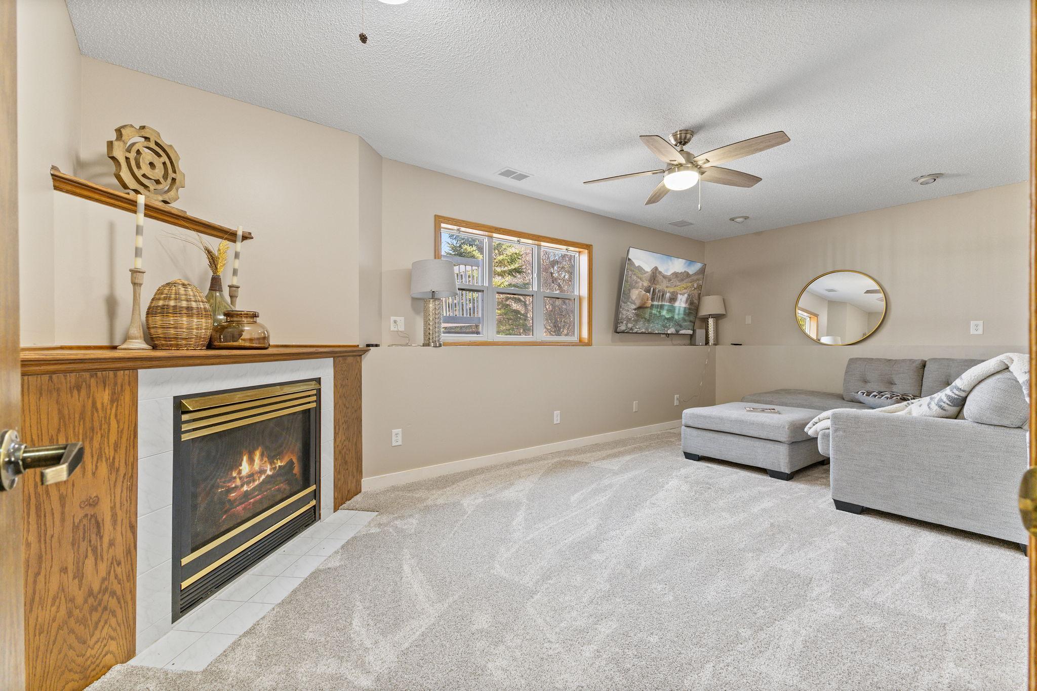 The lower level seamlessly extends your living and entertaining space with a cozy family room.