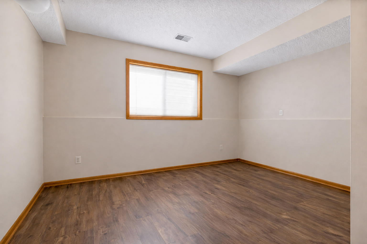 The lower level also offers a third bedroom with hard surface floors and fresh paint.