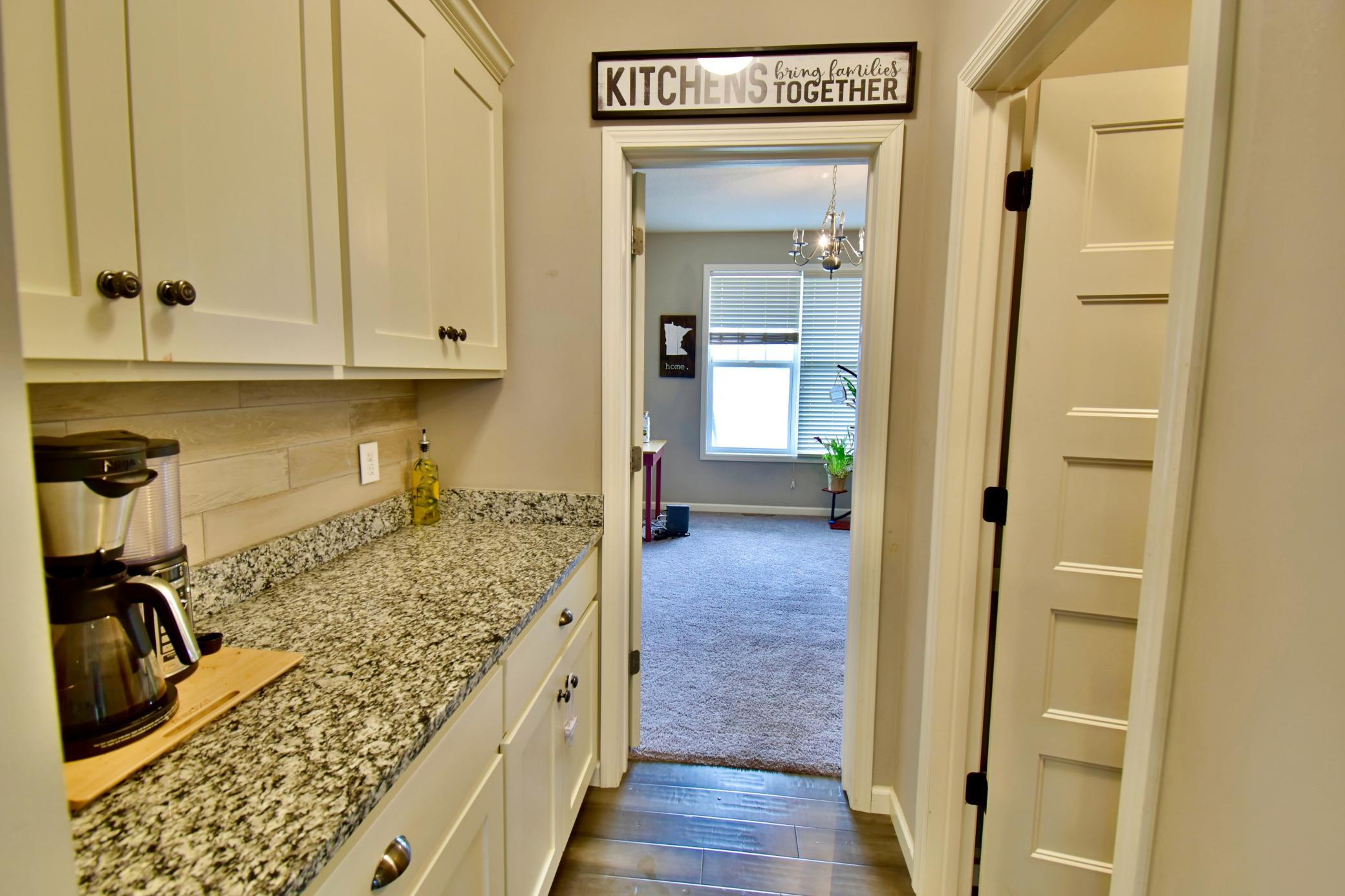 Butler Pantry with tons of storage and large walk-in pantry.