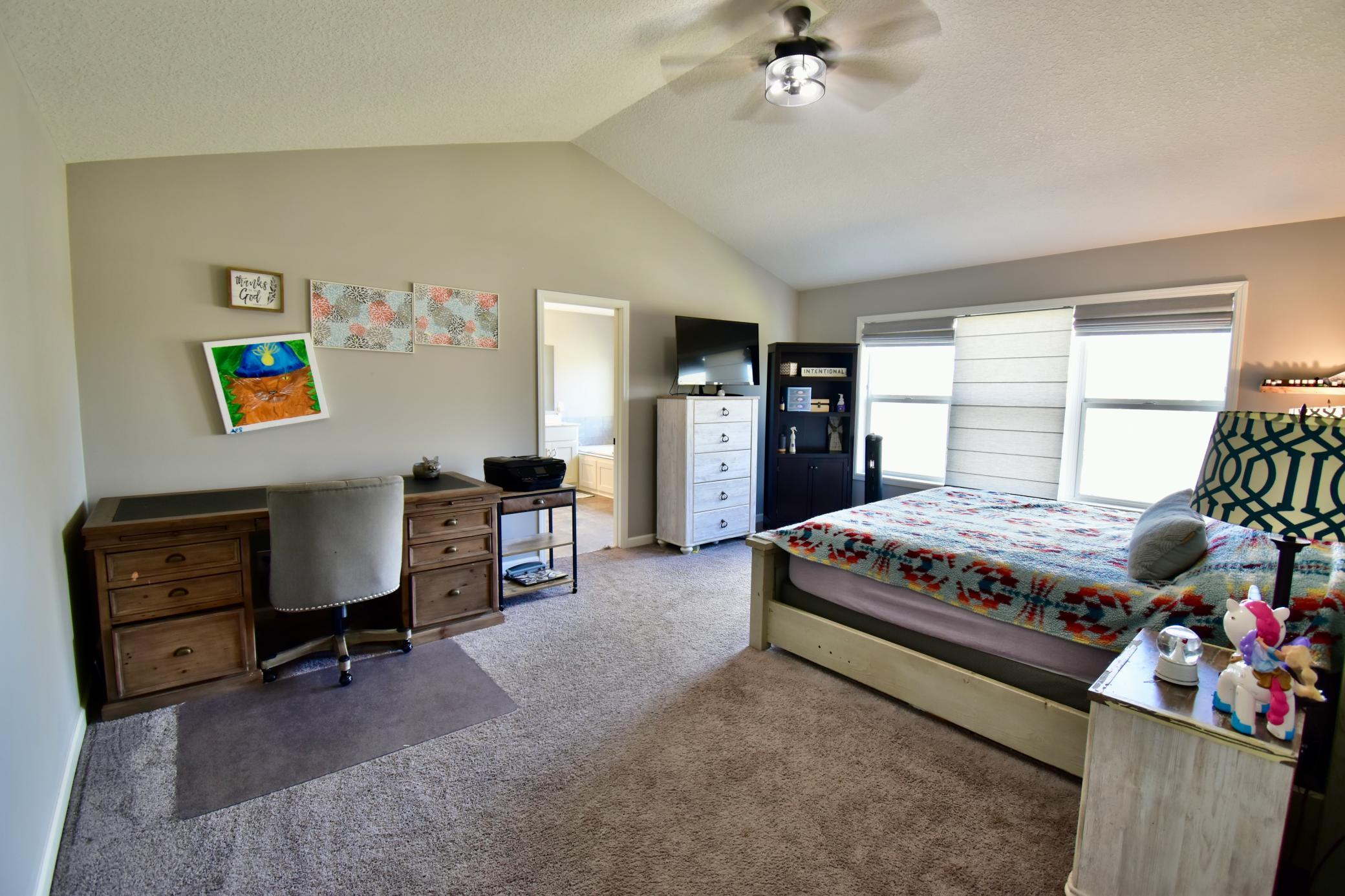 Primary Bedroom, Roman Shades, Fan, and ensuite with tub/separate shower.