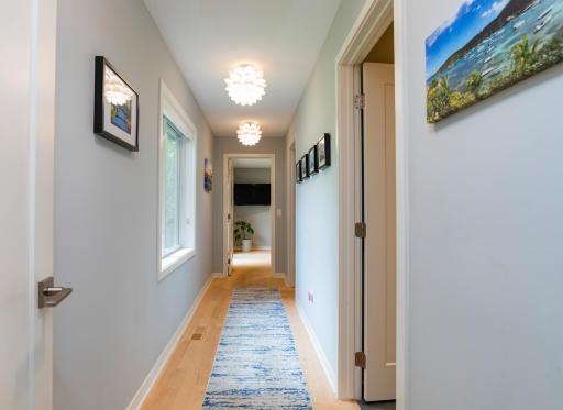 The primary suite "wing" features a large bedroom with access to the private backyard, walk-in closet and four-piece bathroom.