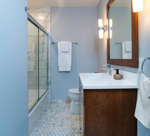 The bathroom for the additional bedrooms has stunning Italian marble tile work.