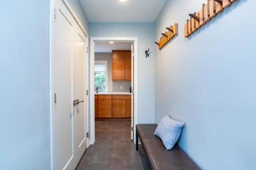The mudroom offers both hooks and a closet to enclose all of your coats and foot wear.
