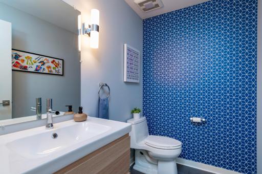 A convenient powder room off of the main living room for guests, or easy access from the back yard.