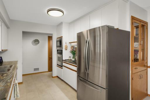 Newer Stainless Steel appliances and new flooring in kitchen.