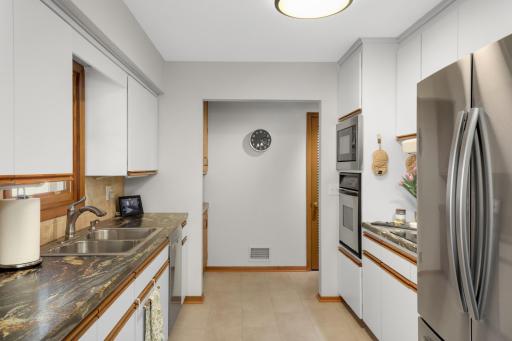 Newer Stainless Steel appliances and new flooring in kitchen.