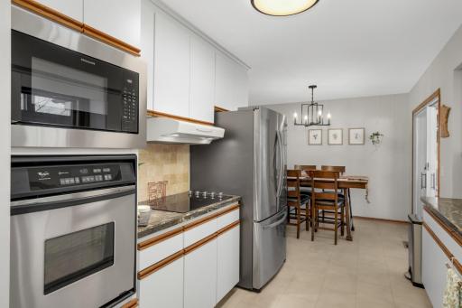 Newer Stainless Steel appliances and new flooring in kitchen.