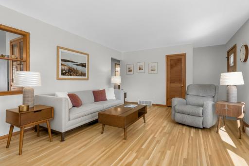 Spacious living room. Gleaming hardwood floors!