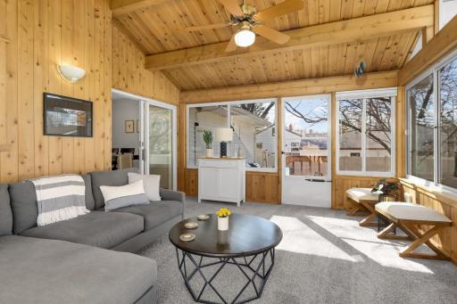 Sunroom opens to your fenced backyard with vinyl privacy fencing.