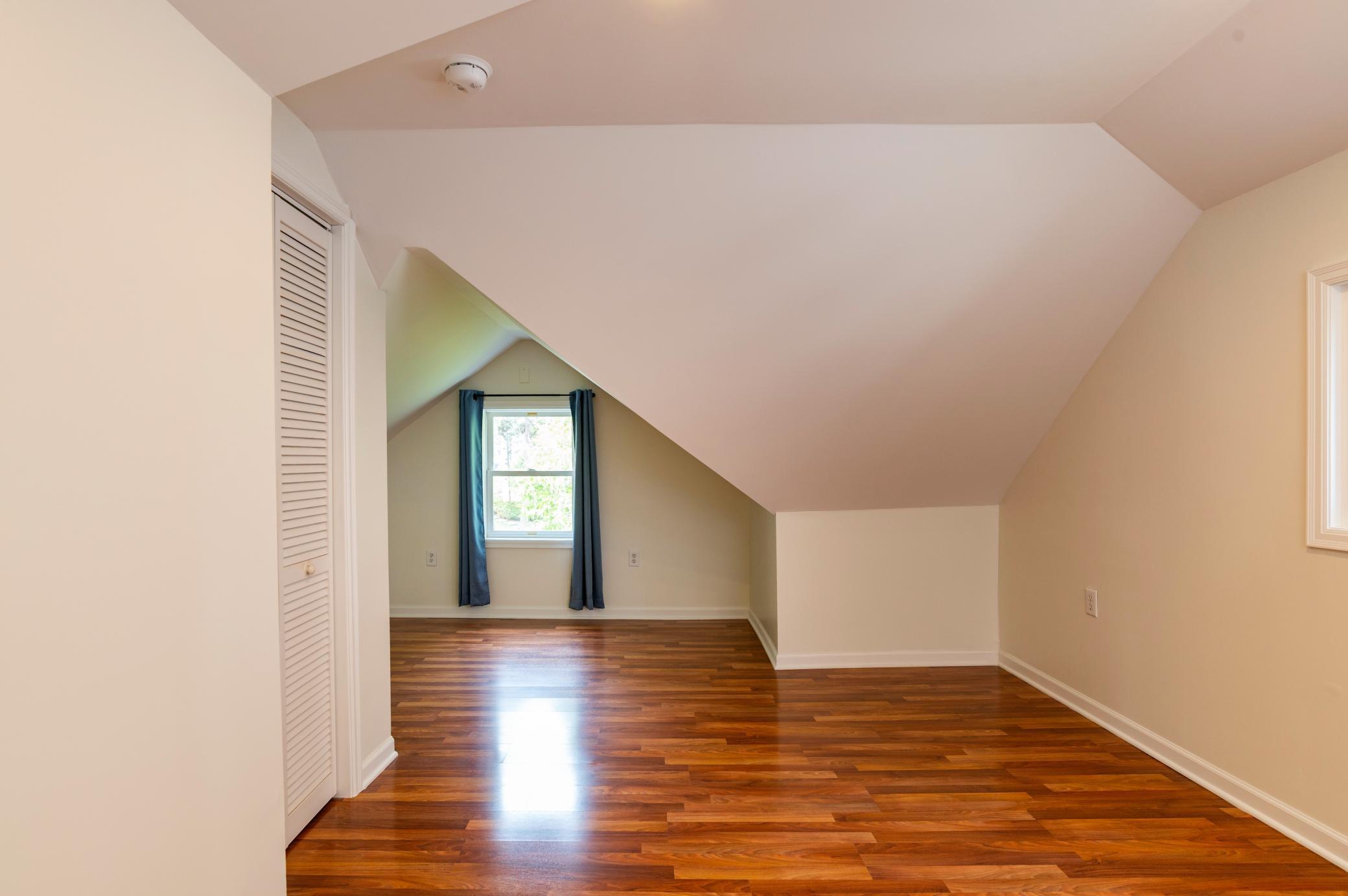The cozy sitting space off the primary bedroom is the perfect space to curl up with a book.