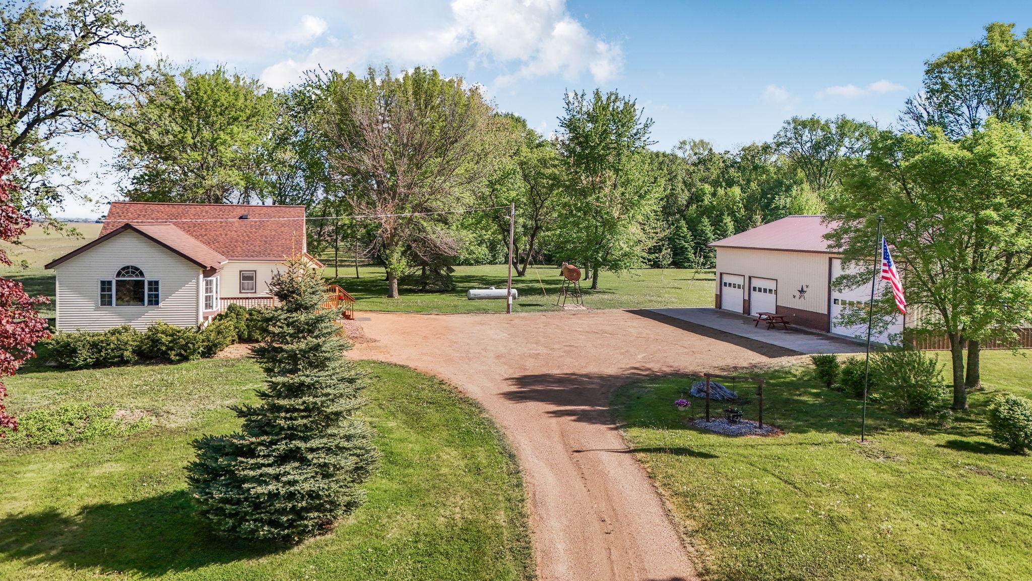 Country living on 7.62 acres with a 60 x 36 Shed