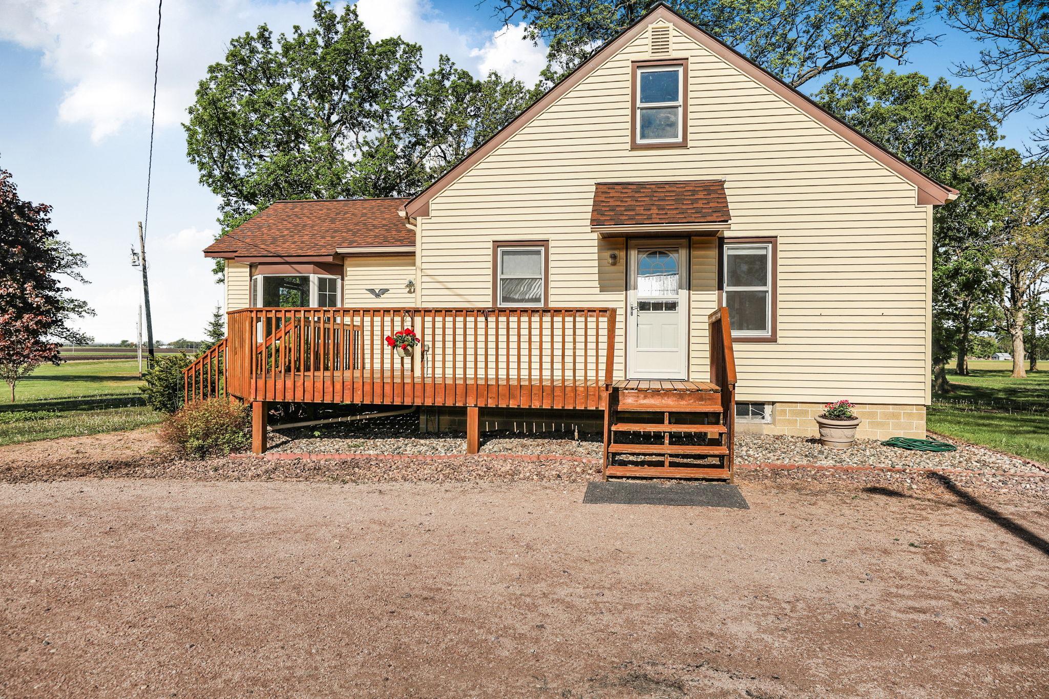 House with large wrap around deck