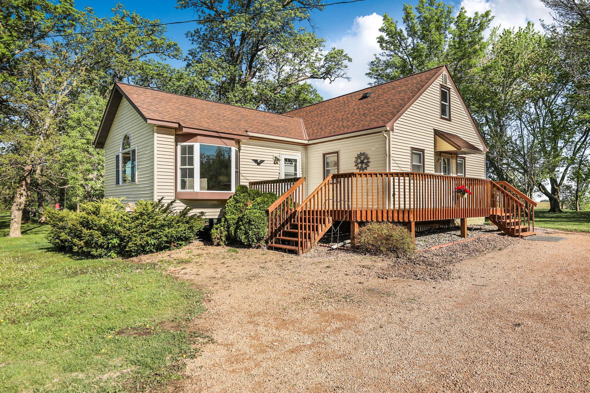 Front of house with large wrap around deck