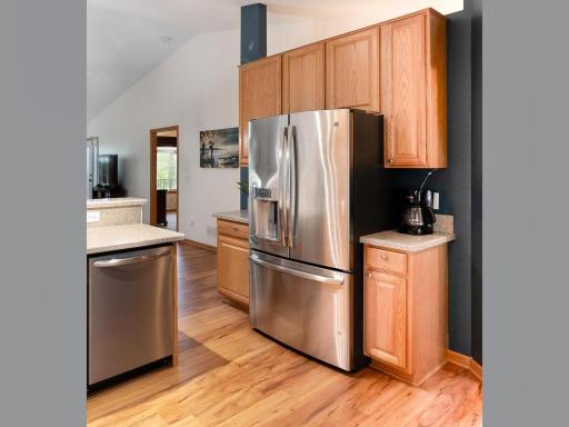 The countertops on either side of the fridge are perfect for a coffee station and landing zone for all the things.