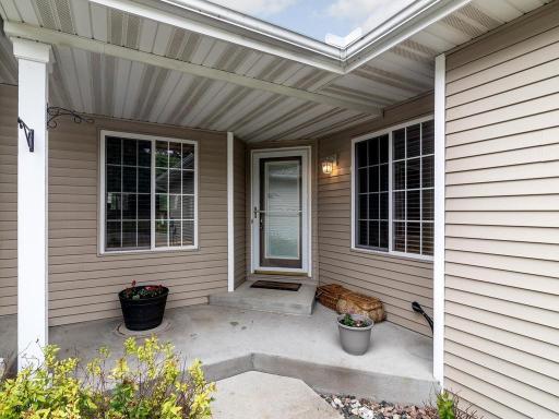 Enjoy front porch living with space for planters and chairs.
