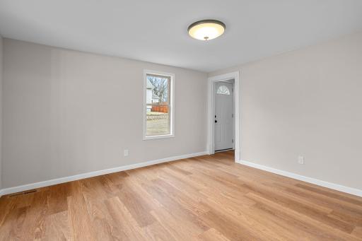 Living room is bright and airy with fresh paint and updated electrical.