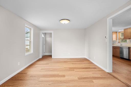 Living room is bright and airy with fresh paint and updated electrical.