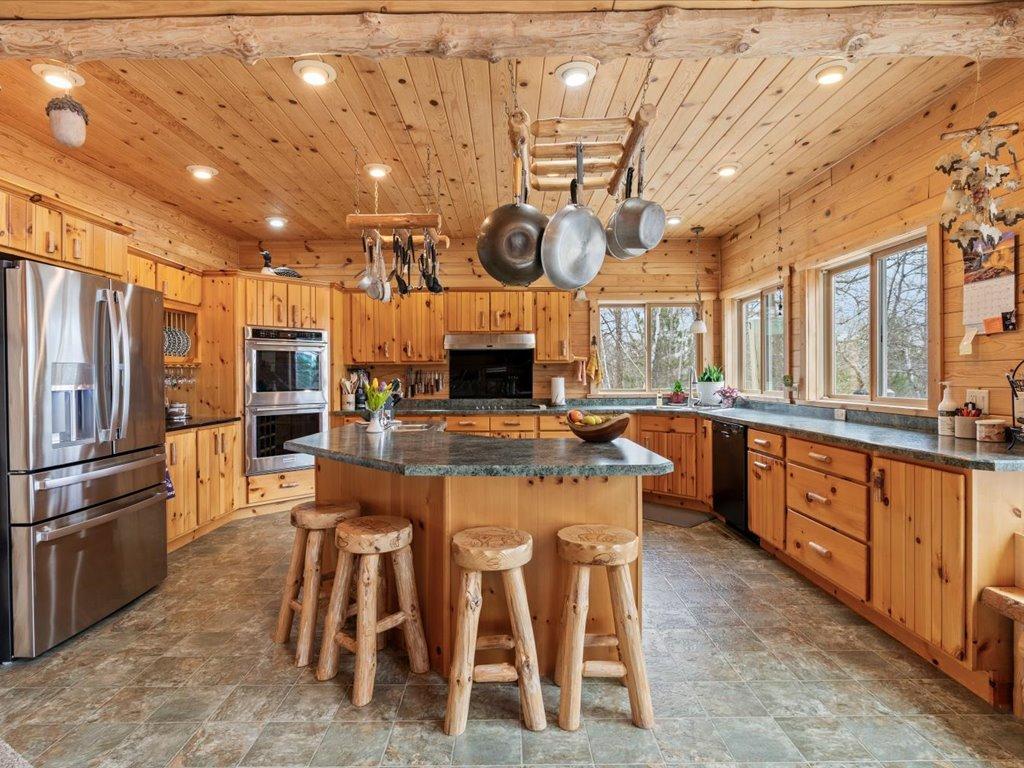 Open kitchen with spacious windows on lakeside.