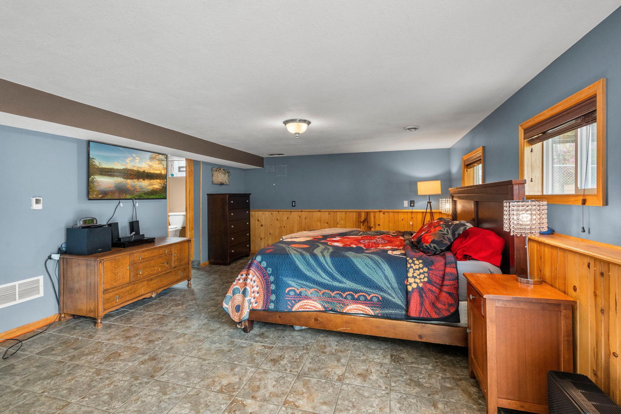 Lower level- current owners are using lower level as a primary suite but this could easily be used as a family room!