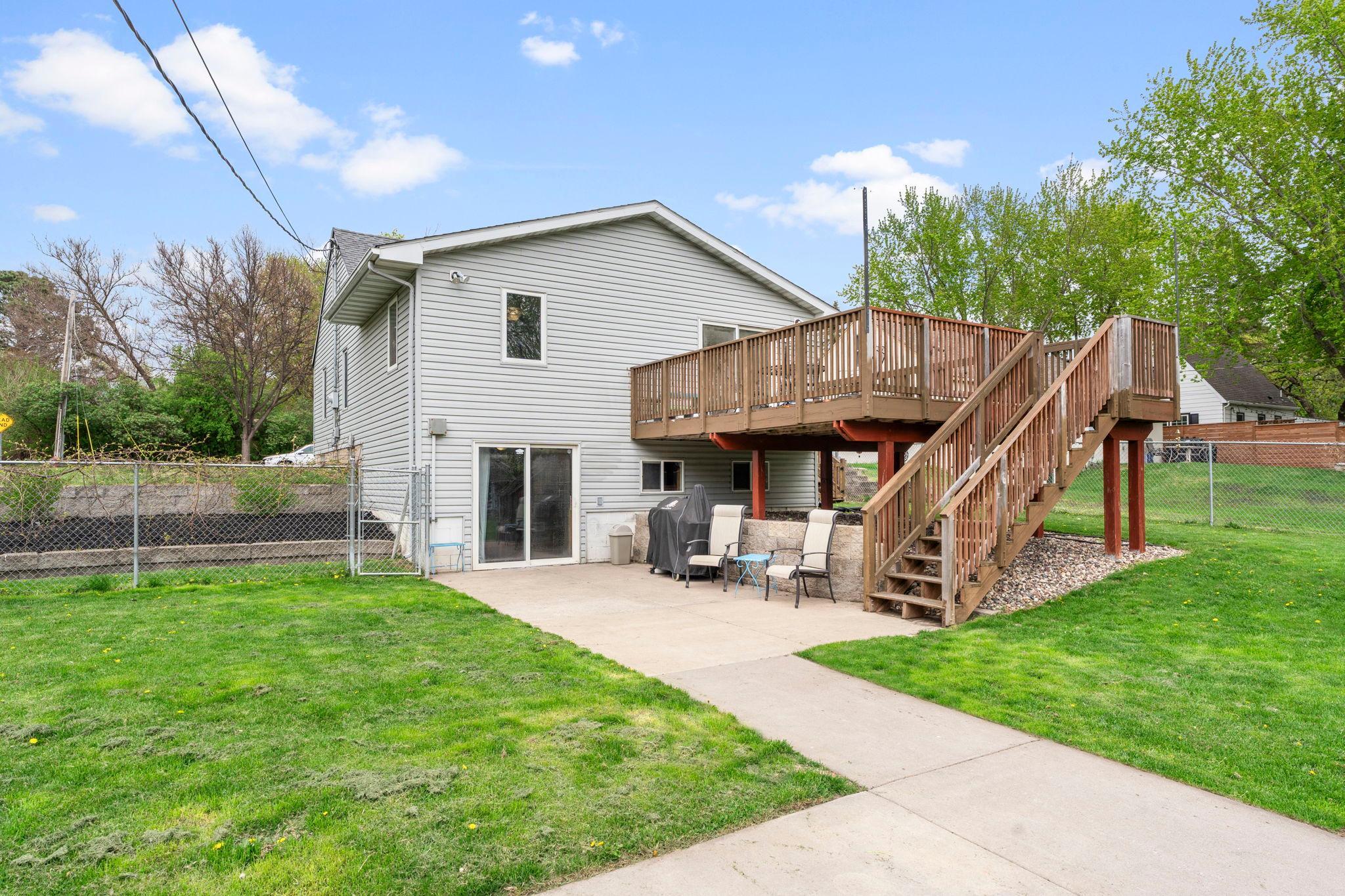 Backyard features a lovely walkout to the patio area and a lovely sized deck with stairs