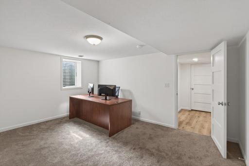 Private lower-level fourth bedroom with egress window.