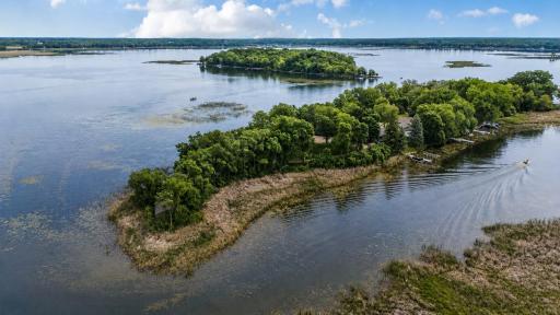 With 955 feet of shoreline, panoramic water views, and the rare privacy of your own peninsula, this extraordinary Clearwater Lake property is an unparalleled lakefront retreat.