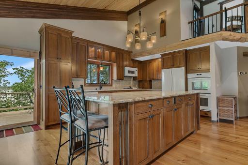 Large center island provides the perfect place for meal prep, casual dining, and conversation.