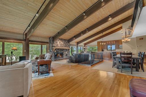The home offers a desirable floor plan with two bedrooms on the main level and two additional bedrooms on the upper level, providing comfortable accommodations for family and guests.