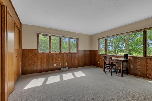 Perfect for family or visitors, this second main level bedroom combines convenience, privacy, and scenic views.