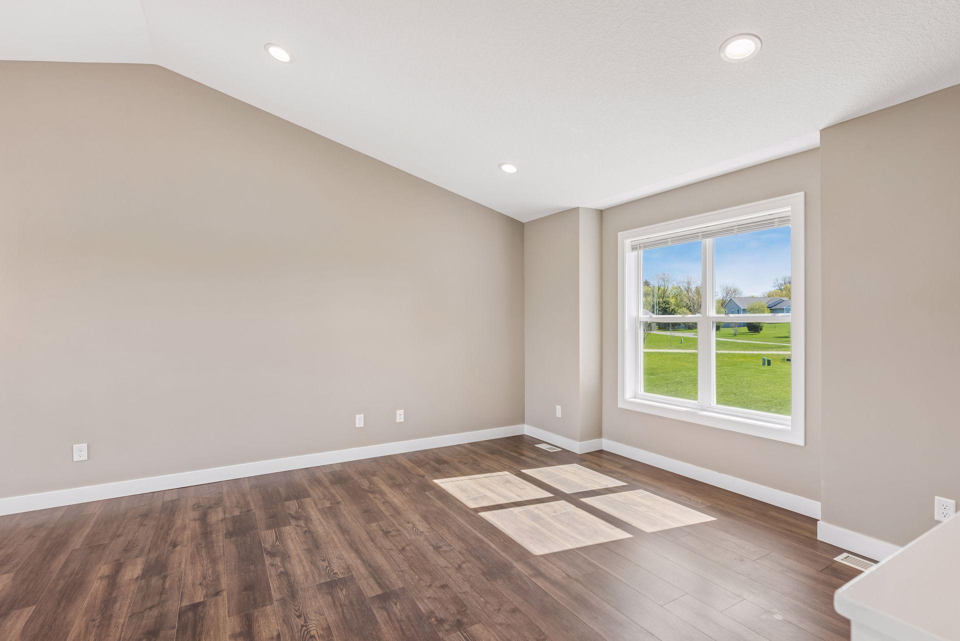 Vaulted ceilings and recessed lighting in the main living room area. Plus enjoy the sun shining in!