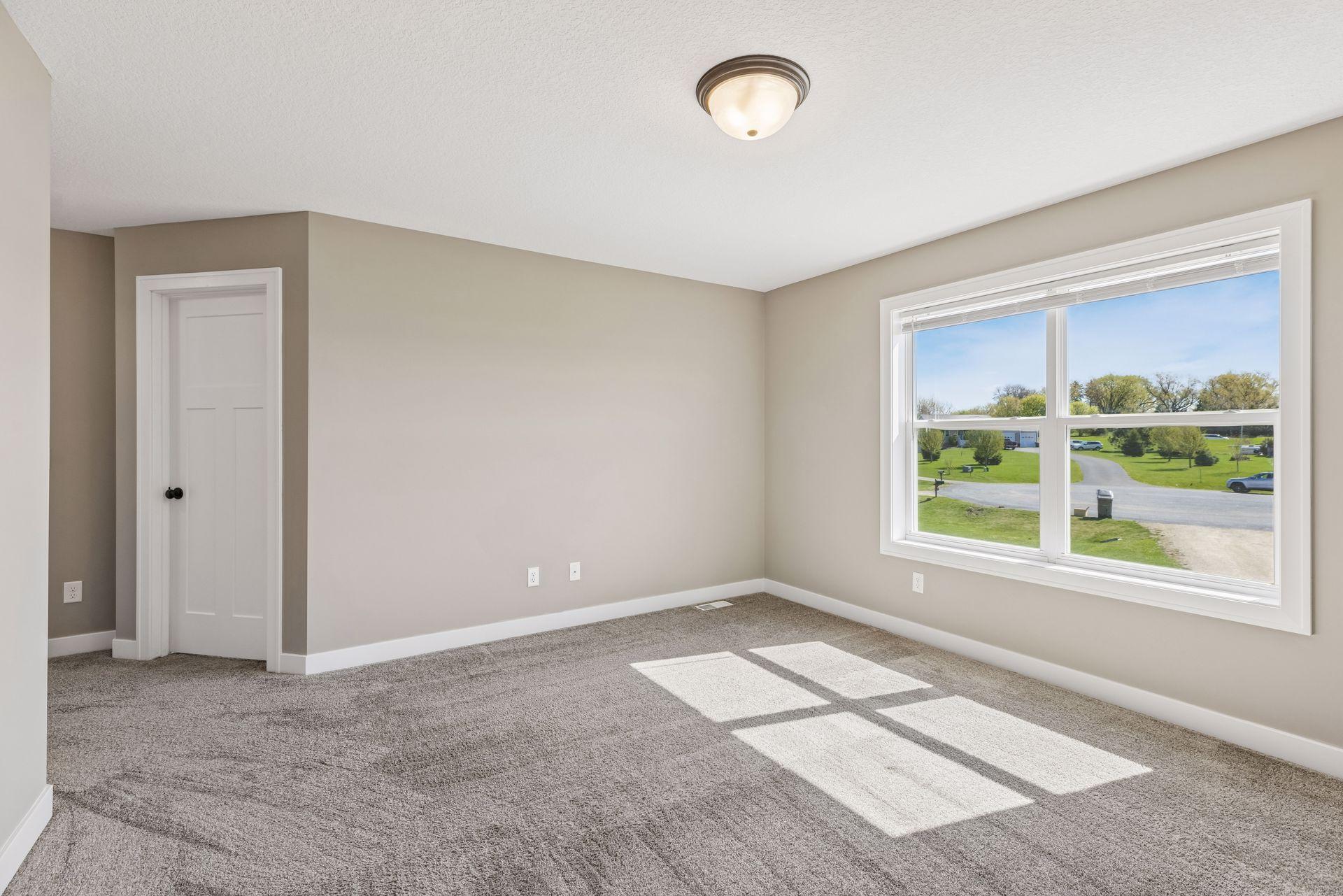Large owners suite on its own level featuring a walk in closet and large private full bath.