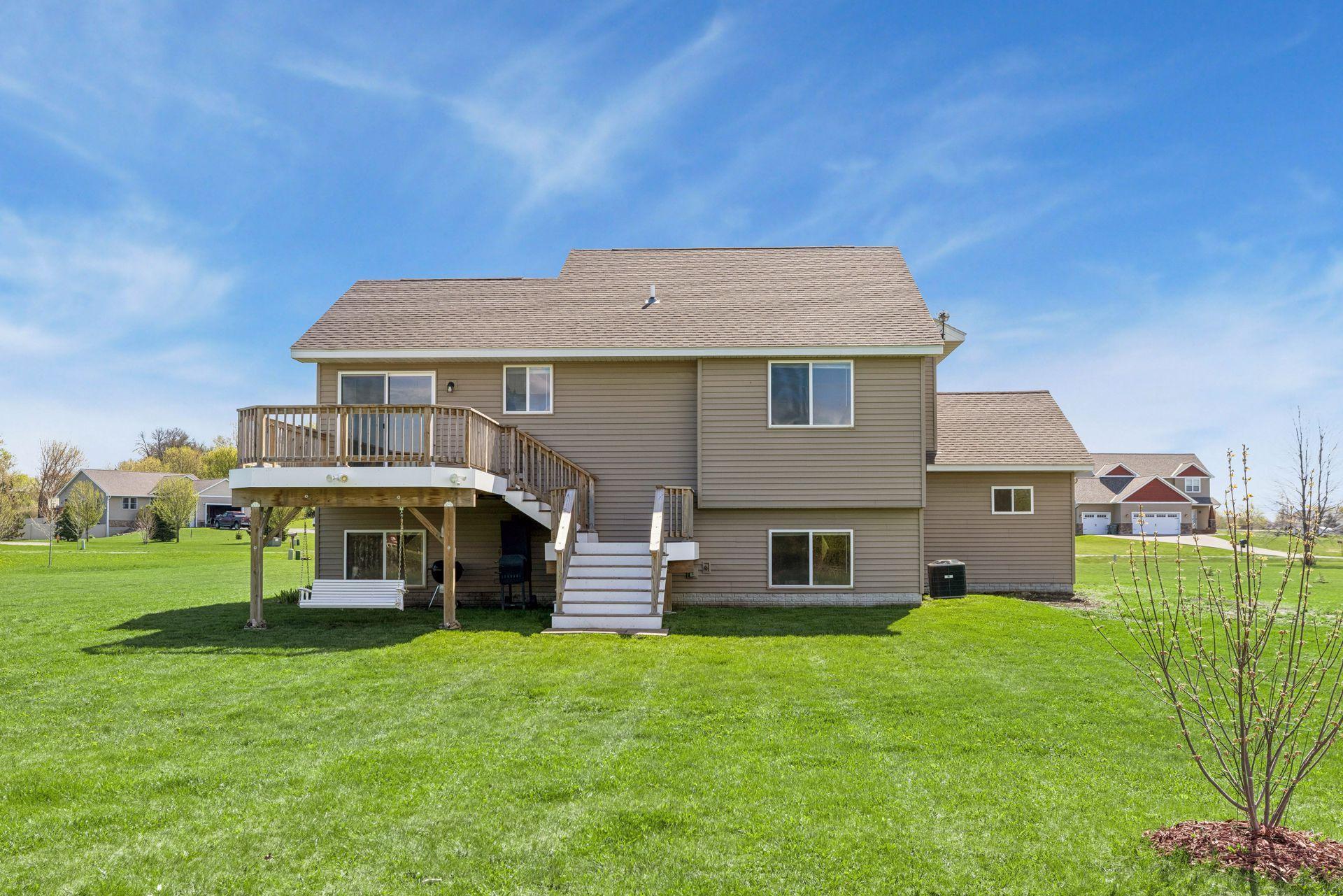 Beautiful backyard space, enjoy the deck swing as you admire your 1.69 acre yard.