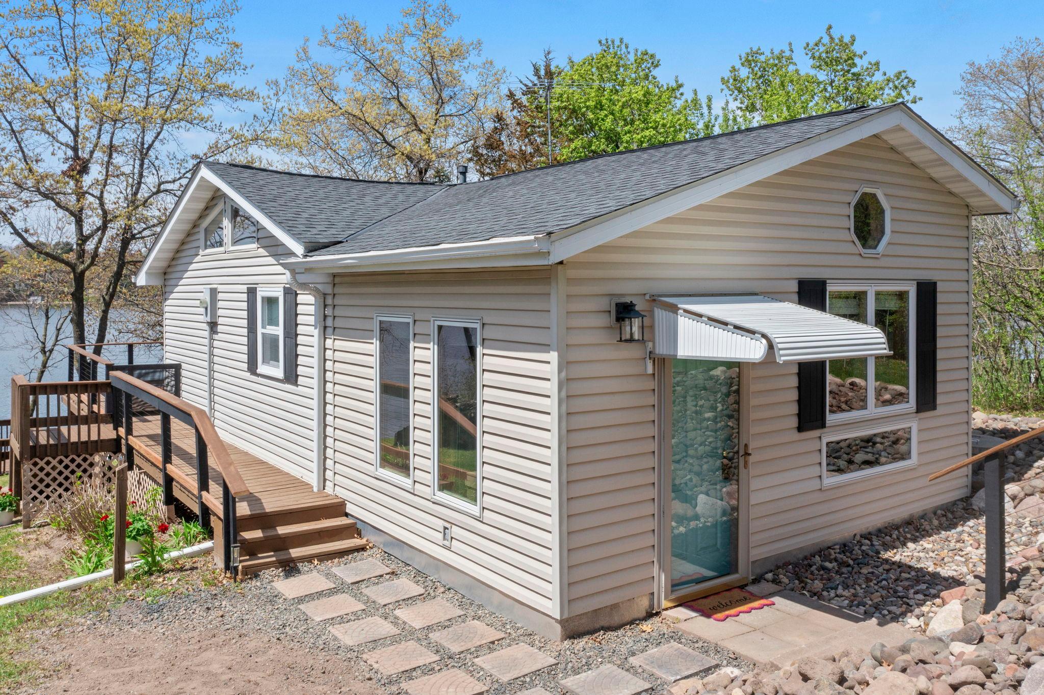 This vibrant 3 bedroom cabin boasts a quant interior and beautiful views of the lake.