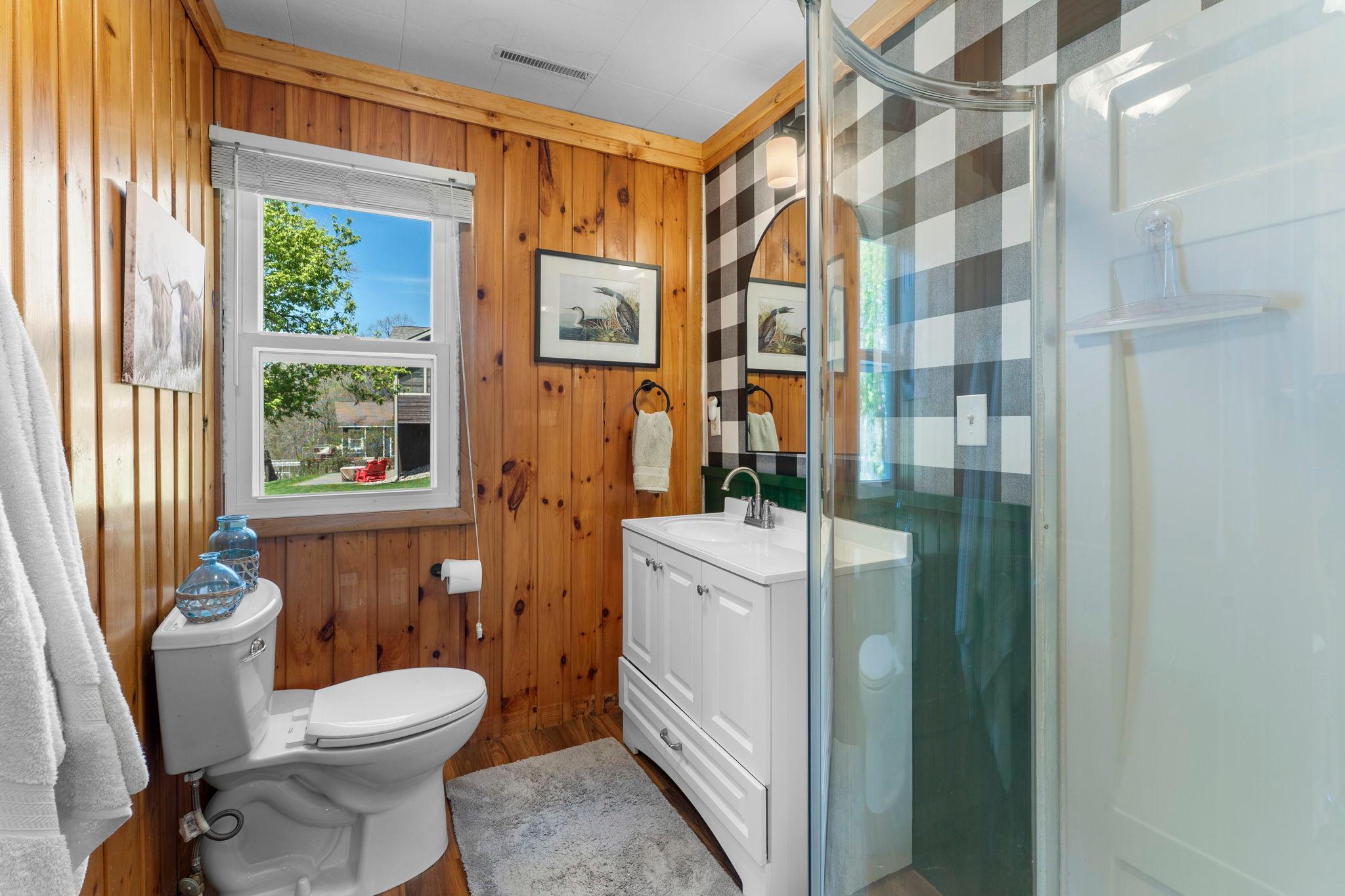 The bath has been updated with paint, wallpaper, lights and trim on the ceilings.