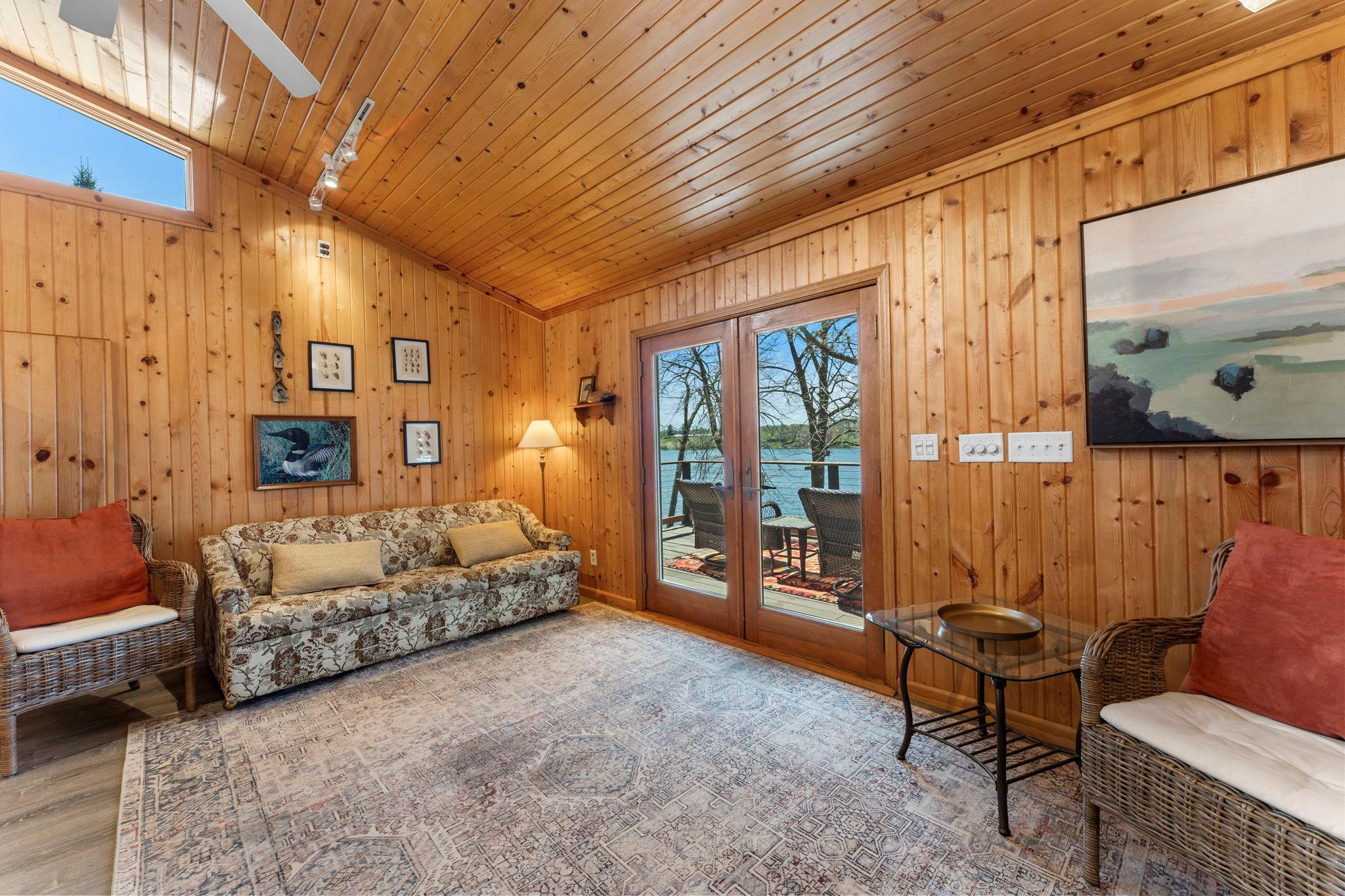 The back of the cabin opens to the spacious deck with vast views of the lake.