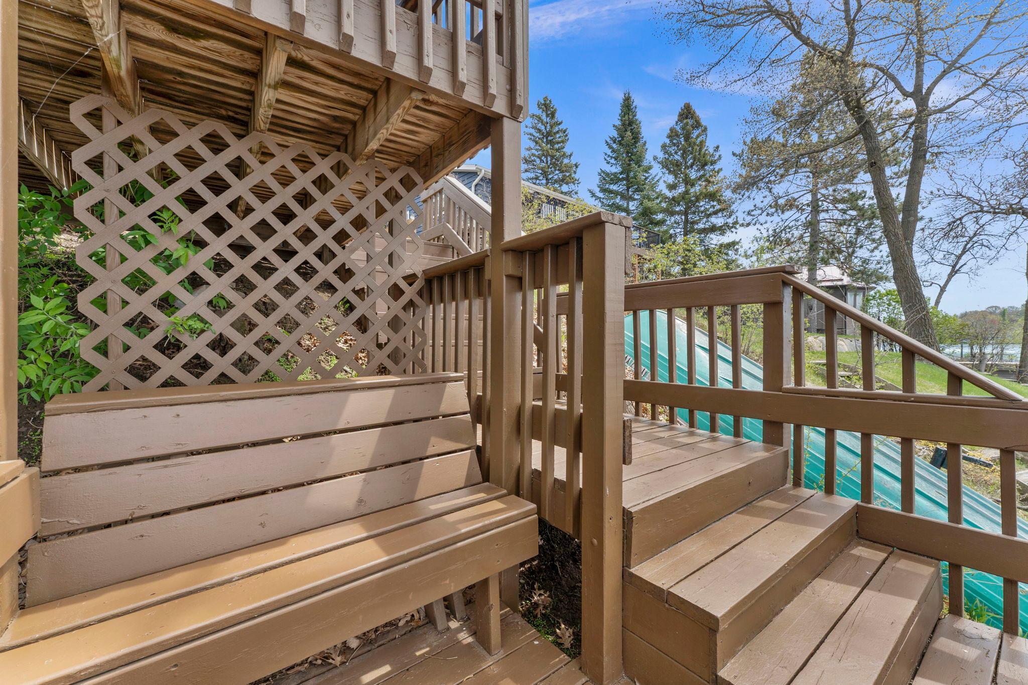 Cute little built in bench sits on the stairs to the lake.
