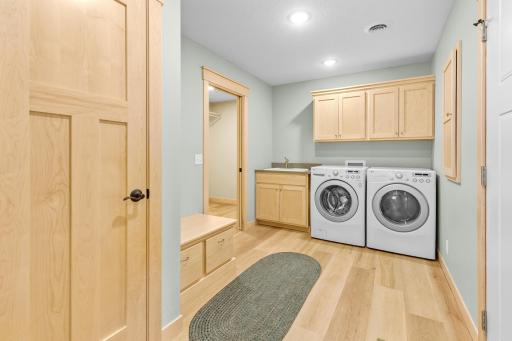 The Laundry Room boasts wonderful storage, and bench for additional storage space.
