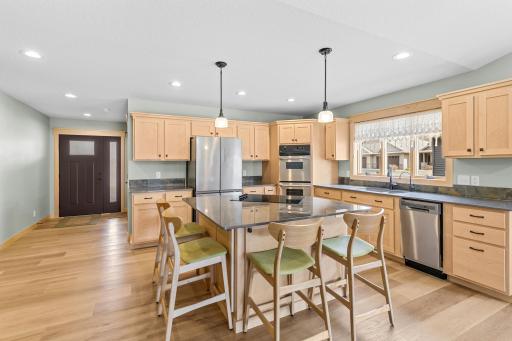 The Kitchen also features a stainless steel double oven, dishwasher and refrigerator. There's also a reverse osmosis system, and a Pantry with pull-out drawers. This Kitchen boasts convenience and beauty.