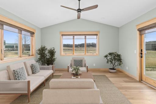 The Sunroom will be your favorite room. With an abundance of natural light and scenic views, this room offers the ultimate in tranquility. The sliding glass door gives you access to the private patio. (Virtually staged).