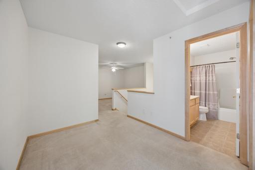 Spacious loft offers versatility for hobbies, office, or family room