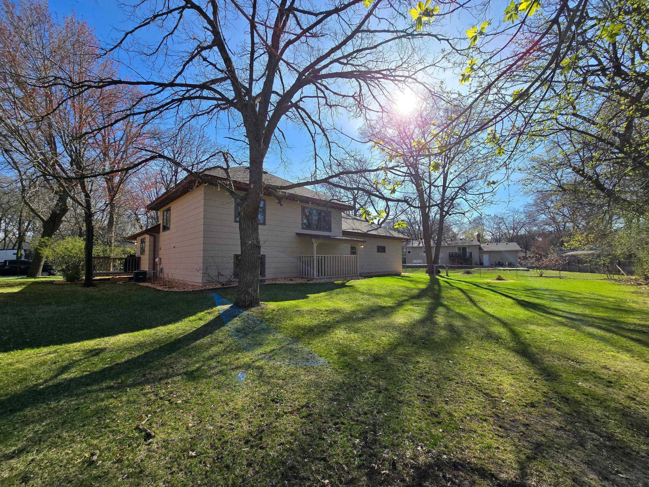 A flat, grassy backyard offering a wide, open space that’s both functional and inviting. The level terrain is ideal for outdoor activities, play, or entertaining, while the lush lawn provides a clean, well-kept look.