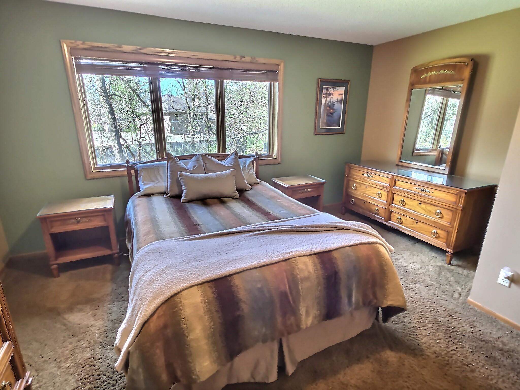 Upstairs, you’ll find all three bedrooms together, including a spacious primary suite with its own private bath, plus an additional full bathroom for convenience. Pictured here is the primary suite.