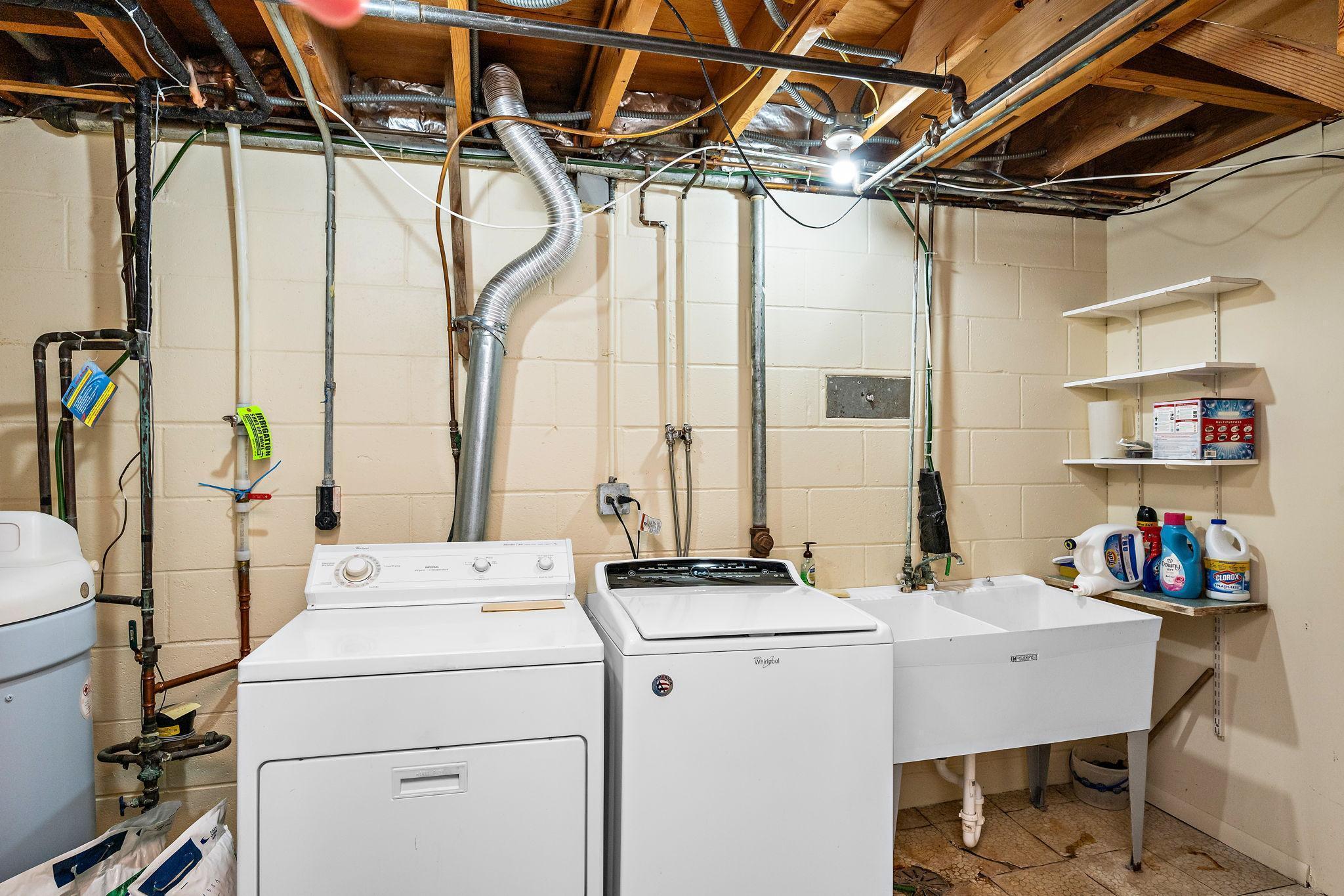 Laundry area with sink in the mechanical room!
