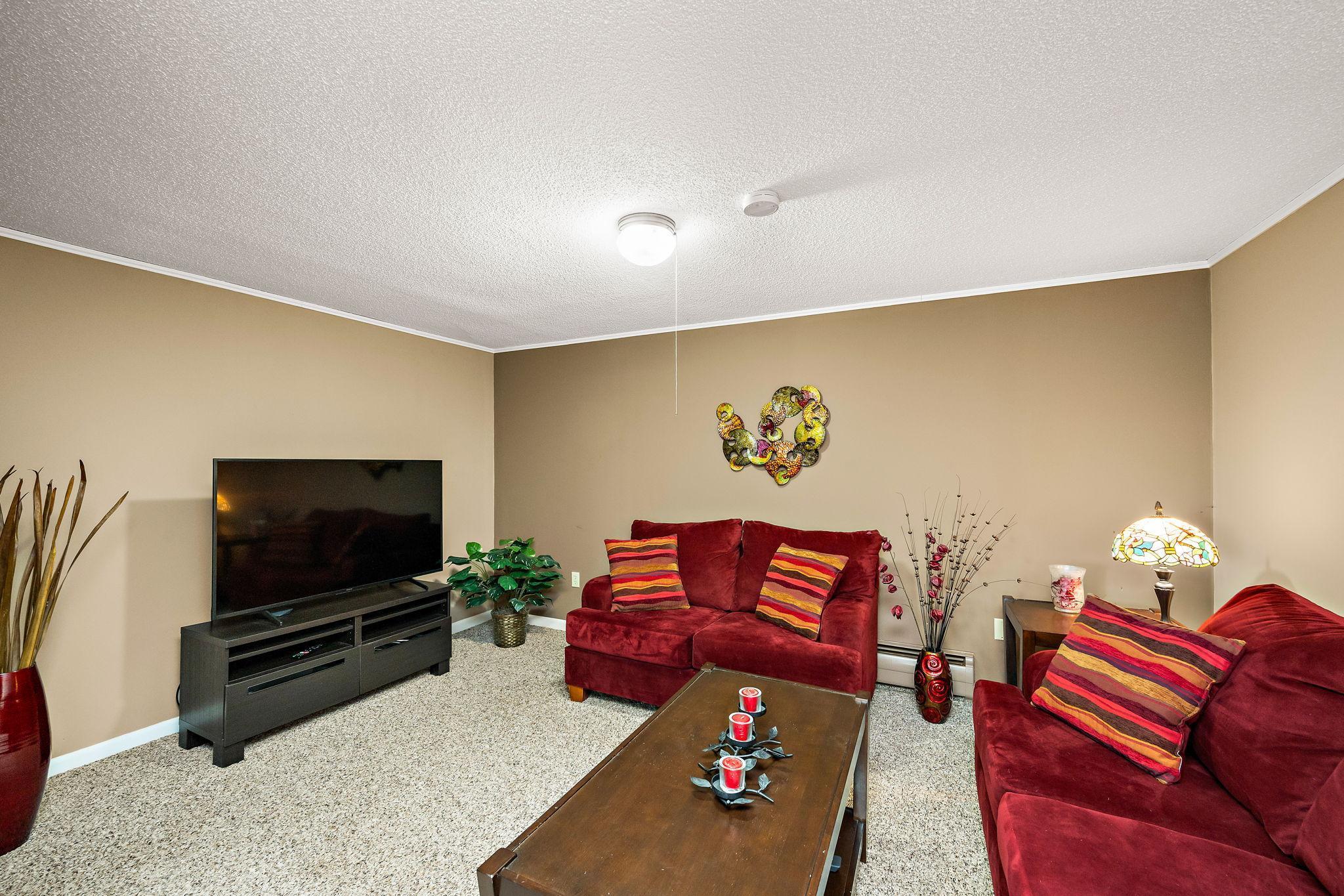 Great movie/media space…a bit darker to enjoy the big screen, but still connected to the rest of the lower level!