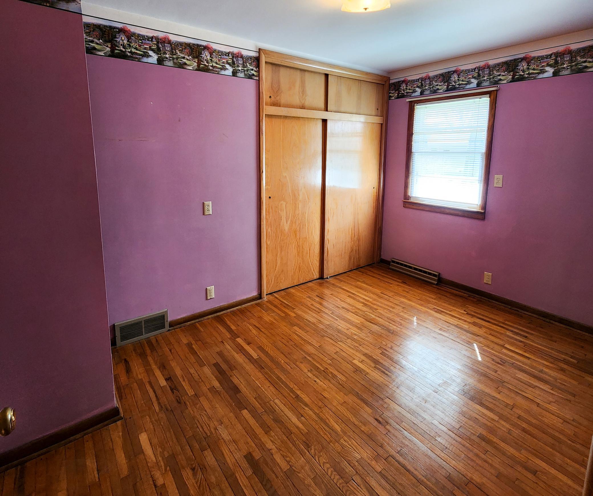 Bed 2 of three - all with original hardwood floors that are in excellent condition.jpg