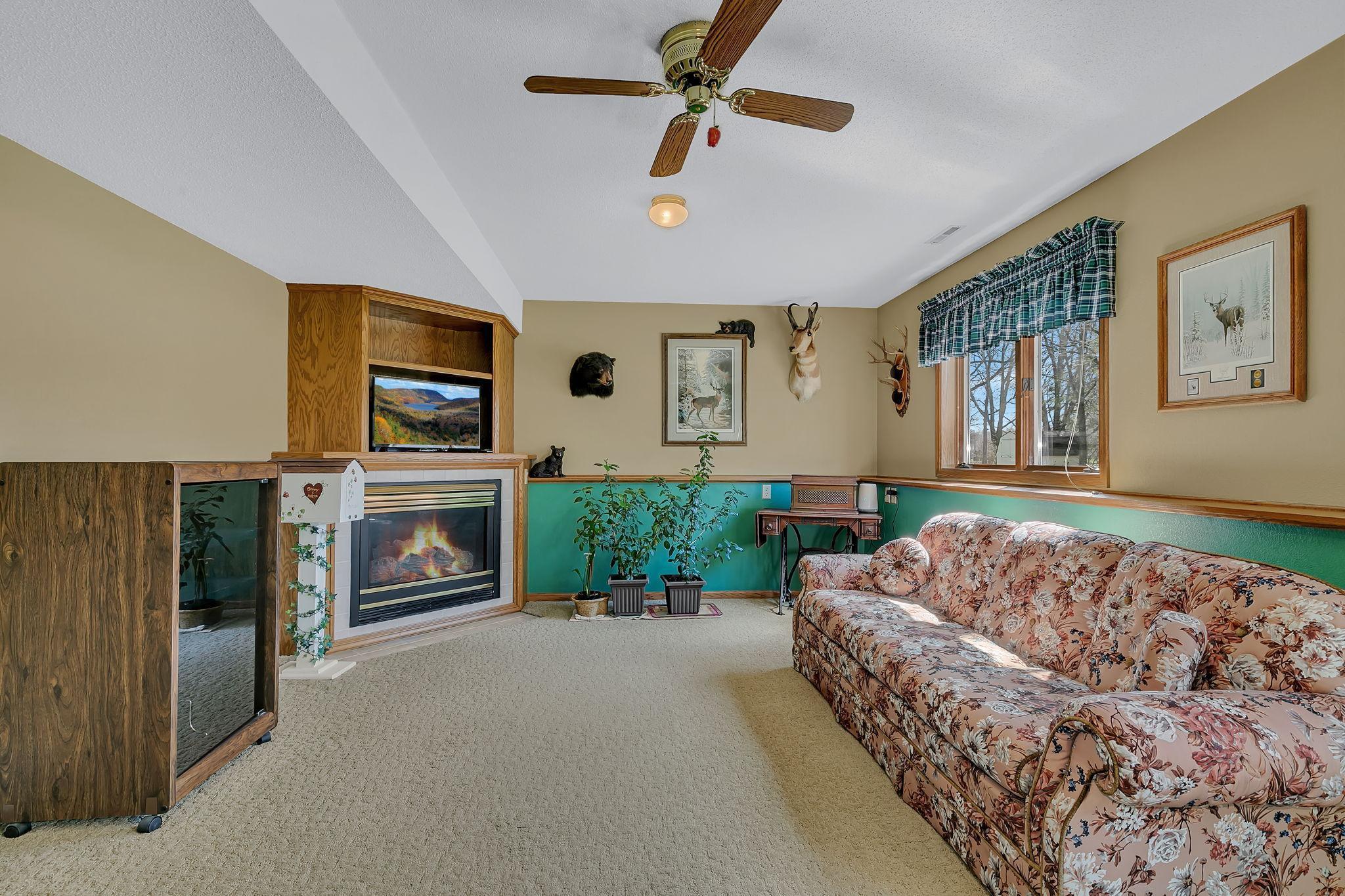 Lower level family room w/corner gas fireplace