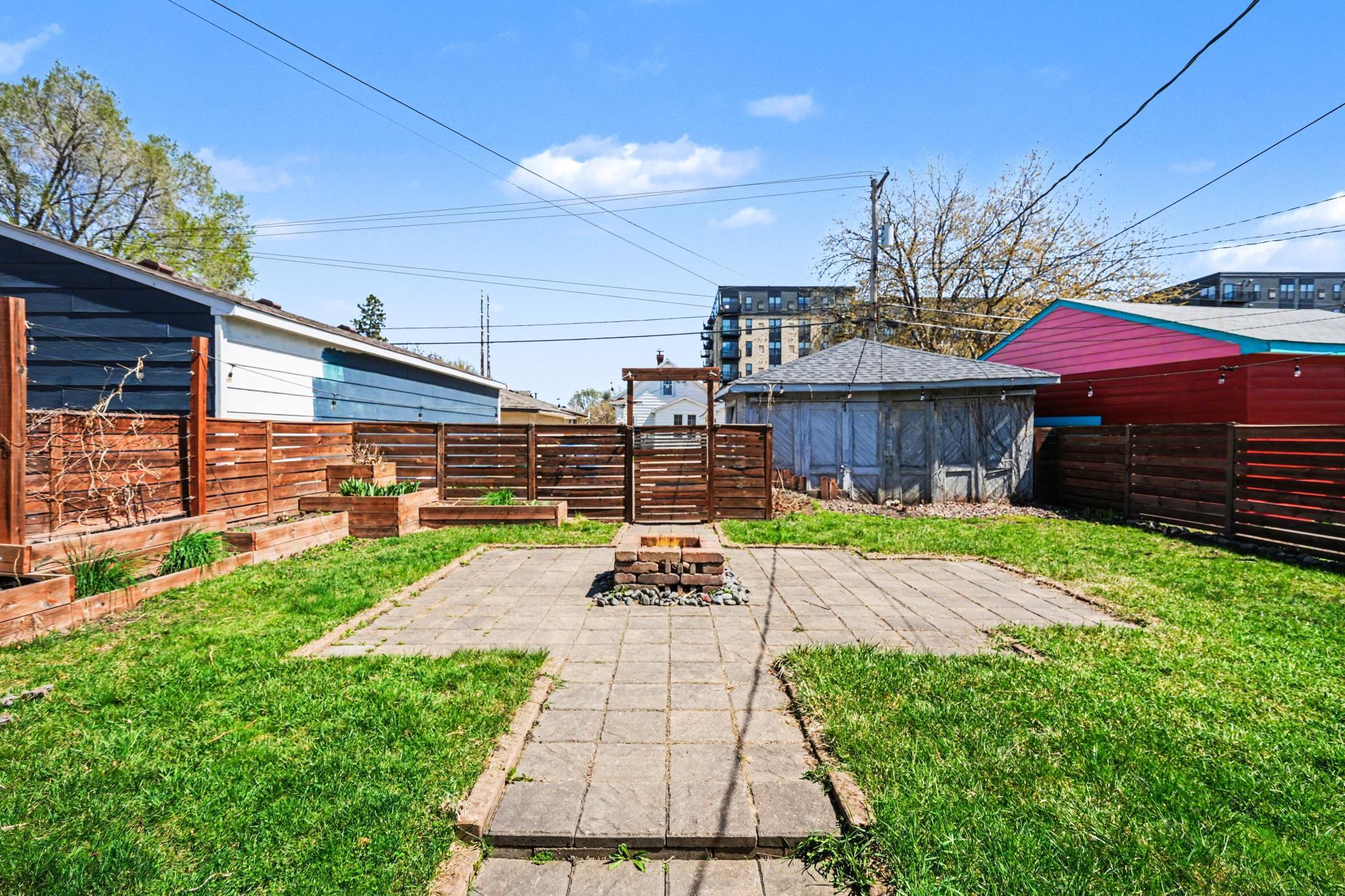 Large Backyard w/Raised garden beds, patio, fire pit