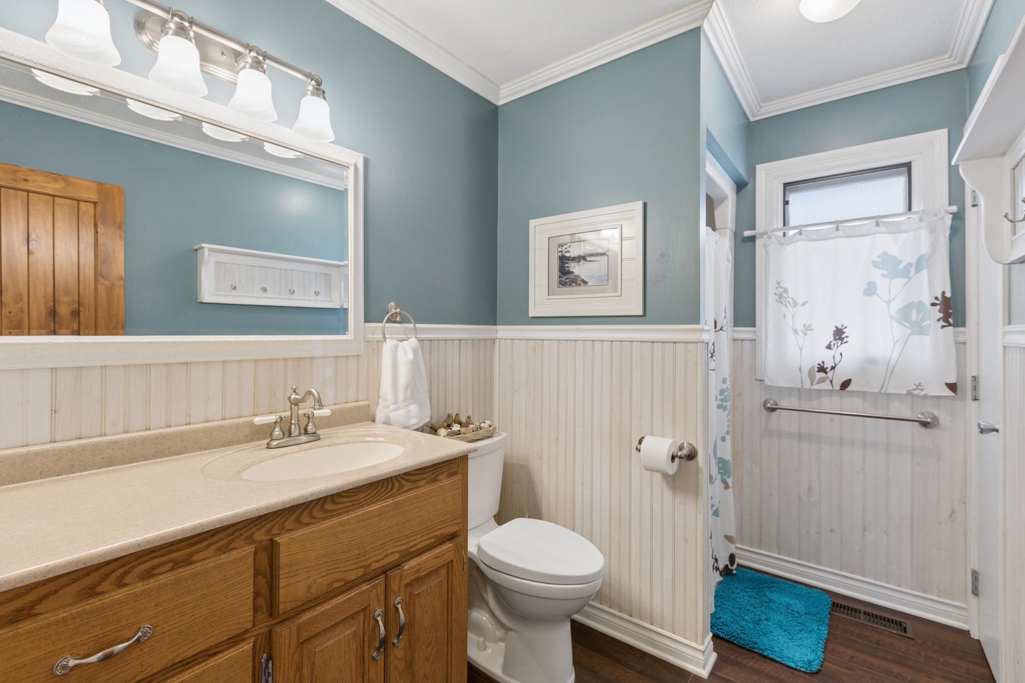 Centrally located between the two main floor bedrooms and the main floor living space is a 3/4 bathroom.